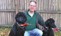 Pictured with his dogs, Lucy and Henry, Mark Vail has rekindled his former talent as a master potter. 