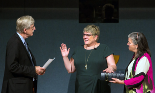 National Institutes of Health Director Francis S. Collins, M.D., Ph.D., swears in Patricia Flatley Brennan, R.N., Ph.D., as the 19th director of NLM. 